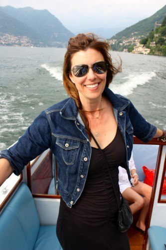 Denim jacket and black ruched dress on Lake Como